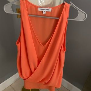 Elizabeth James sexy v top , orange color
